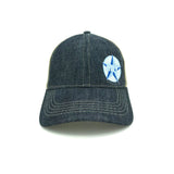 A Blue denim bill and front with a clay colored mesh back. Adjustable velcro strap on the back. A small Blue Star Highway logo on the front left panel.