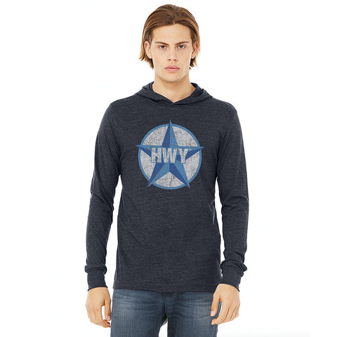 A guy wearing a Vintage Heather Navy Long Sleeve Hoodie T-Shirt with a two toned blue graphic of the Blue Star Highway logo on it.